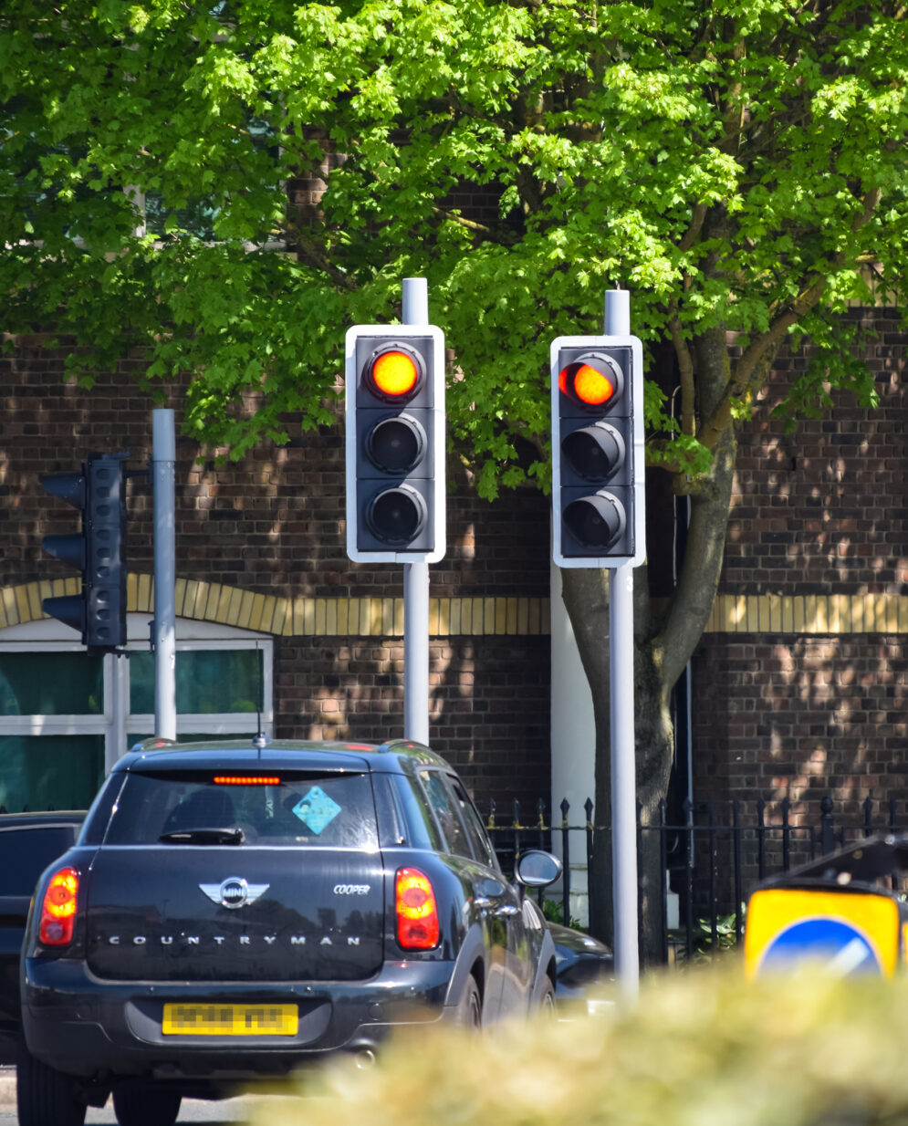 GEM vehicle at red traffic signals Shutterstock